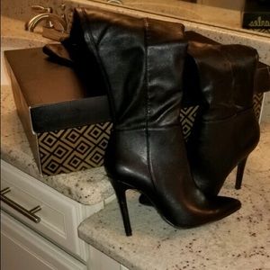 Thigh high black leather boots